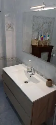 a bathroom with a white sink and a mirror at ary's house in Rome
