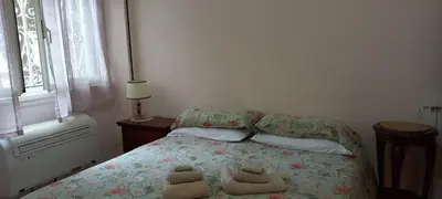 a bedroom with a bed with two towels on it at ary's house in Rome