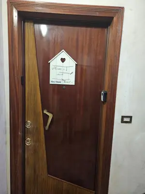 a wooden door with a sign on it at Mary House in Rome