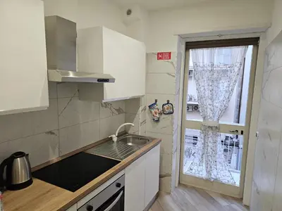 a small kitchen with a sink and a window at Mary House in Rome