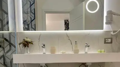 a bathroom with a sink and a mirror at Centro Solferino Rooms in Rome