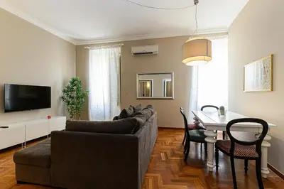 a living room with a couch and a table at Comfortable & Cozy by NDP rent in Rome
