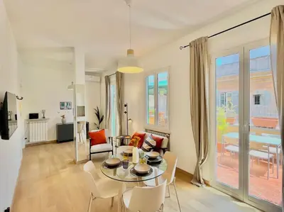 a living room with a table and chairs at Roma San Pietro rooftop view in Rome