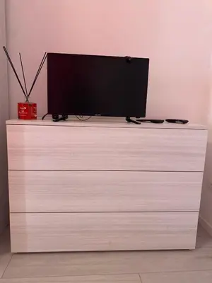 a flat screen tv sitting on top of a dresser at Dany & Manu House in Rome
