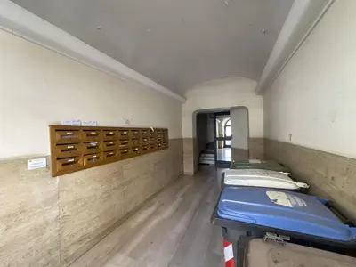a room with a row of beds in it at Bright and Lovely Apartment in San Lorenzo in Rome