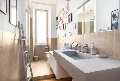 a white bathroom with a sink and a mirror at Beautiful Apartment Rome Vaticano in Rome