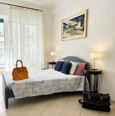 a bedroom with a bed with a purse on it at PR - appartamento in centro a Roma in Rome