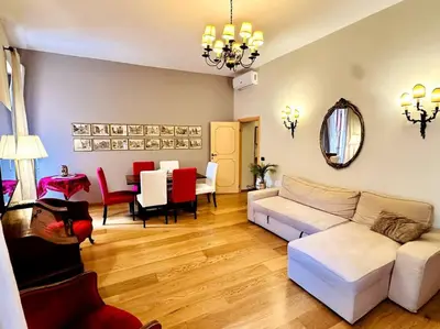 a living room with a couch and a dining room at Benedetta house Trastevere in Rome