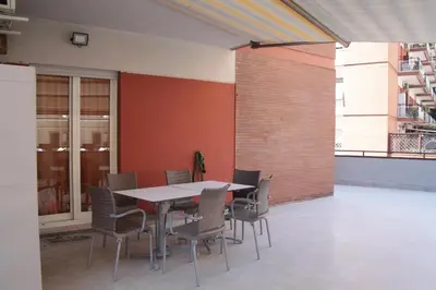 a dining room with a table and chairs at Mauri's Home - CasaMauri - Adiacente Metro C in Rome