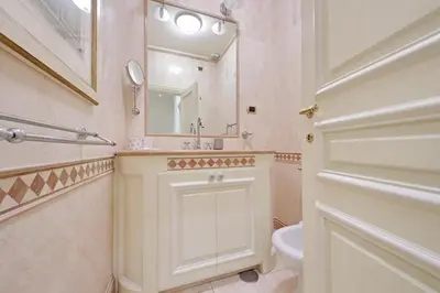 a bathroom with a sink and a mirror and a toilet at YCH-Magnifica residenza a Campo de Fiori in Rome
