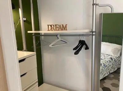 a dream sign on a shelf in a bedroom at Garbatella Garden Home in Rome