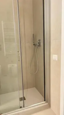 a shower with a glass door in a bathroom at Vatican Lovely Nights-Luxury Rooms in Rome