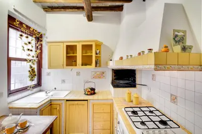 a kitchen with a sink and a stove top oven at Stunning Pantheon Apartment in Rome