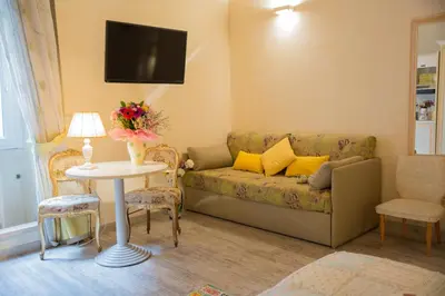 a living room with a couch and a table at Sleeppo B&B in Rome