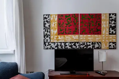 a flat screen tv sitting on a table in a living room at iFlat Lina Cavalieri House in Rome