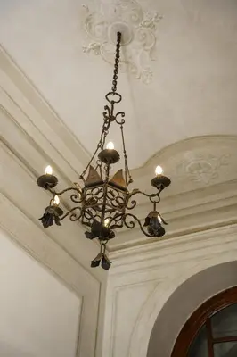 a chandelier hanging from a ceiling in a room at Po49 Appartamento in Rome