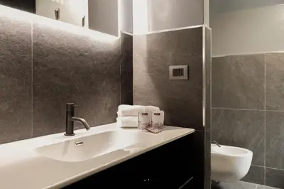a bathroom with a sink and a toilet at Margutta Exclusive Apartment by Romeloft in Rome
