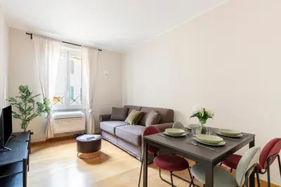 a living room with a couch and a table at Casa Acaia by Hili in Rome