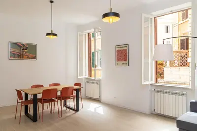 a dining room with a table and chairs at Mastai Trastevere Home by Rental in Rome in Rome