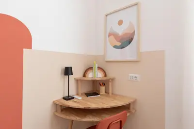 a room with a wooden shelf on the wall at Alba Terrace - Rome Modern Apt Close to Metro in Rome