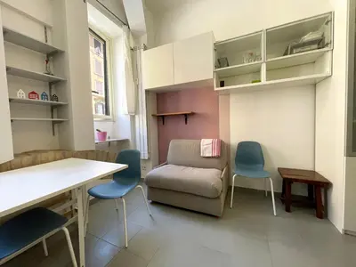 a living room with a couch and two chairs at Blueberry House in Rome