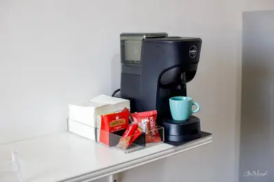 a coffee maker on a shelf with a cup at Vatican Roof Luxury Tiffany terrasse privée in Rome
