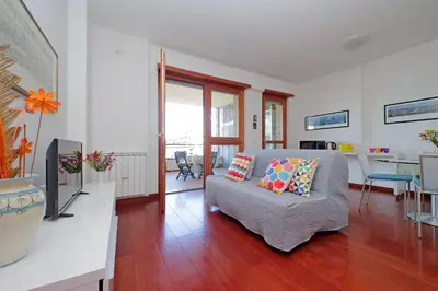 a living room with a couch and a table at YCH-Modern flat with terrace near Eataly in Rome