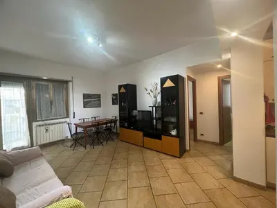 a living room with a couch and a table at Nathan House, Malatesta in Rome