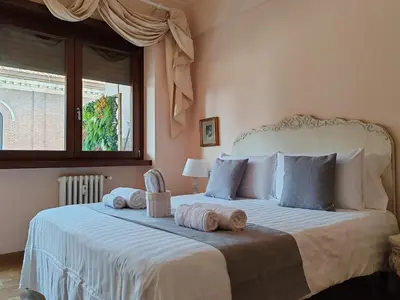 a bedroom with a large bed with towels on it at La Dolce Vita Of Via Veneto - Prestigious Apartment With Wonderful Terrace In the Historic Center in Rome