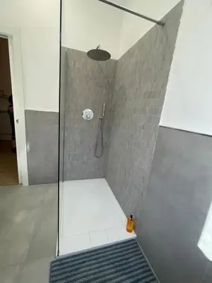 a shower with a glass door and a walk in shower at Enjoy Rhome in Rome