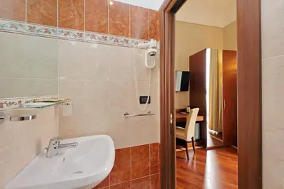 a bathroom with a sink and a toilet in a room at Domus Maggiore in Rome