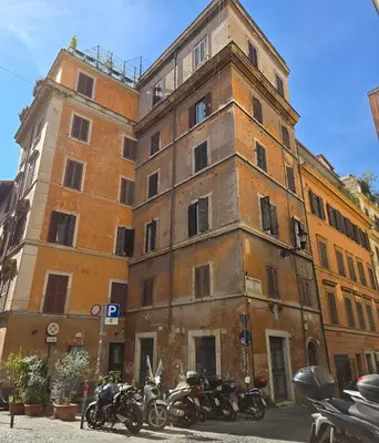 an old building with motorcycles parked in front of it at Hotel Azzurra in Rome