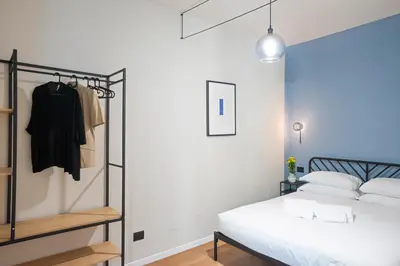 a bedroom with a bed and a closet at Casa Scipioni by Hili in Rome