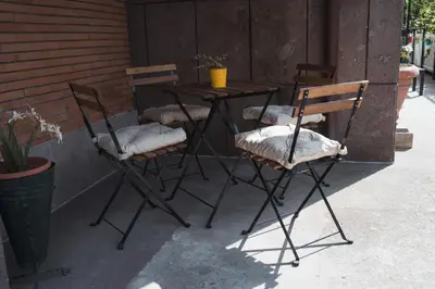 a table and chairs with pillows on a patio at Vatican 4 BedRoom Apartment with Private Parking in Rome
