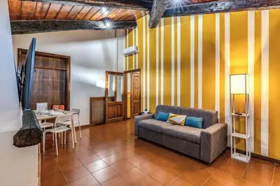 a living room with a couch and a table at Elena Vatican Apartment in Rome