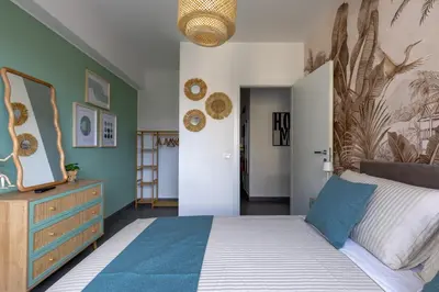 a bedroom with a bed and a dresser in a room at Radio Guest House Intero Appartamento Moderno A Trastevere in Rome
