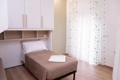 a small room with a bed and a window at Antonella in Rome