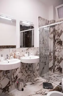 a bathroom with two sinks and a shower at Antonella in Rome