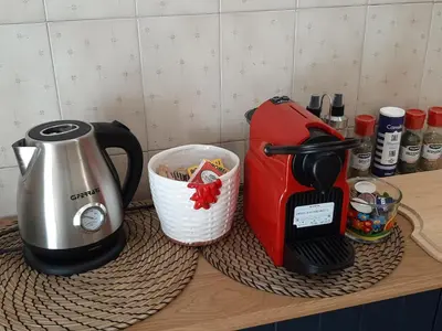 a counter with a coffee maker and a toaster at Roman Holidays Apartment in Rome