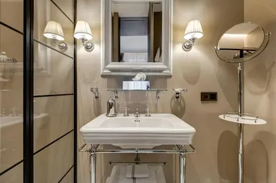 a bathroom with a white sink and a mirror at BDC - Luxurylifestyle in Rome
