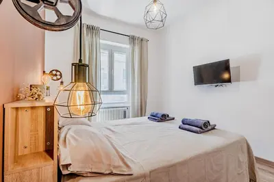 a bedroom with a bed with two towels on it at Inventori House in Rome