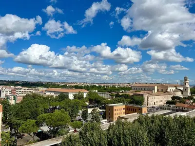 a view of a city under a cloudy sky at Il Cielo Su Roma San Paolo in Rome