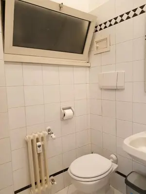 a small bathroom with a toilet and a sink at Monti Parioli de Charme in Rome