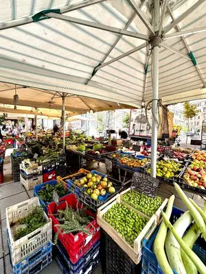 a market with many baskets of fruits and vegetables at Cherry Suites- Timeless Roman Residence & Terrace in Rome