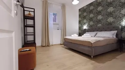 a bedroom with a bed and a staircase in it at Mimmi's house in Rome
