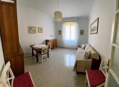 a living room with a couch and a table at Casa vacanza Brandi in Rome