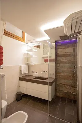 a bathroom with a sink and a shower at Pantheon Luxury Apartment in Rome