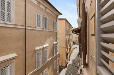 an alley in the city with buildings at Crystal Home Piazza Navona in Rome