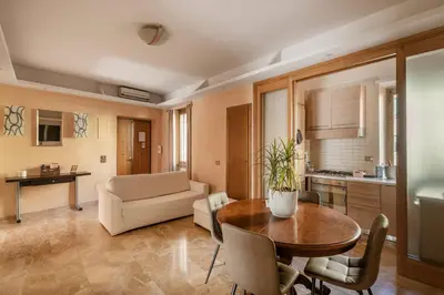 a living room with a table and a couch at Apartment27 Roma in Rome