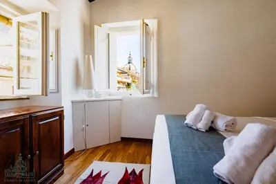 a bedroom with a bed and a window at Domus in Lauro in Rome